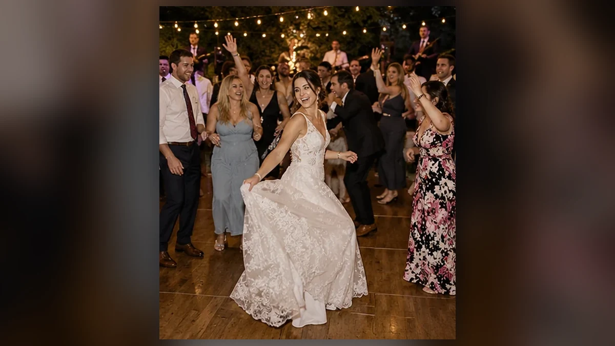 Guests dancing together at a fictional wedding
